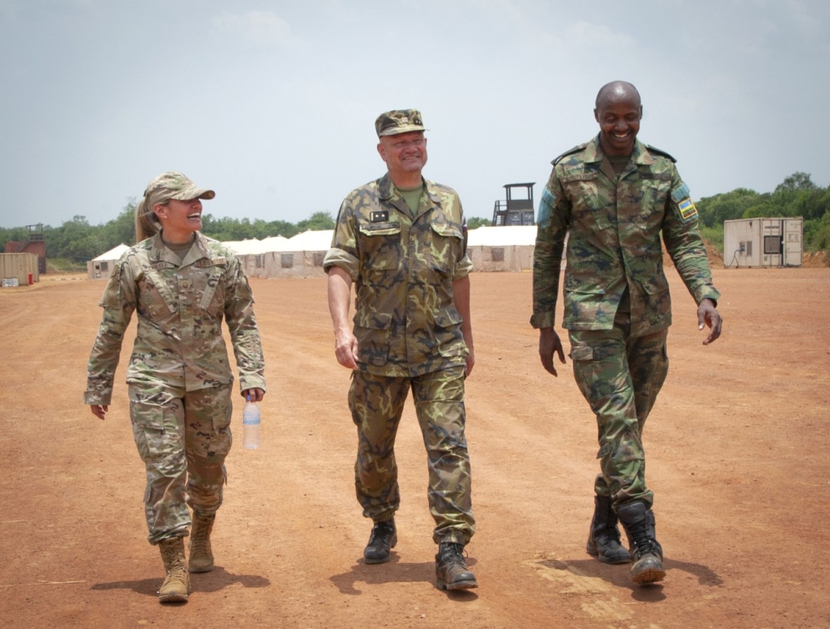 Beginning of a Nebraska-Czech Republic-Rwanda Tri-lateral Relationship (From left) Nebraska Air National Guard Maj. Angela Ling, Lt. Col. Adam Miroslav of the Czech Republic, and Rwandan Defense Force Maj. B. Rutayisire exchange pleasantries while walking across the hospital training site at Gako, Rwanda, on March 16, 2022. The three service members were participating in a medical/engineering exchange exercise conducted in concert with the new State Partnership Program relationship between the Nebraska National Guard and the Rwandan Defense Force. Discussion have also included the potential for forming a unique tri-lateral relationship based upon the Nebraska National Guard's SPP relationship with the Czech Republic that goes back to 1993. (Nebraska National Guard photo by Lt. Col. Kevin Hynes) (Lt. Col. Kevin Hynes)
