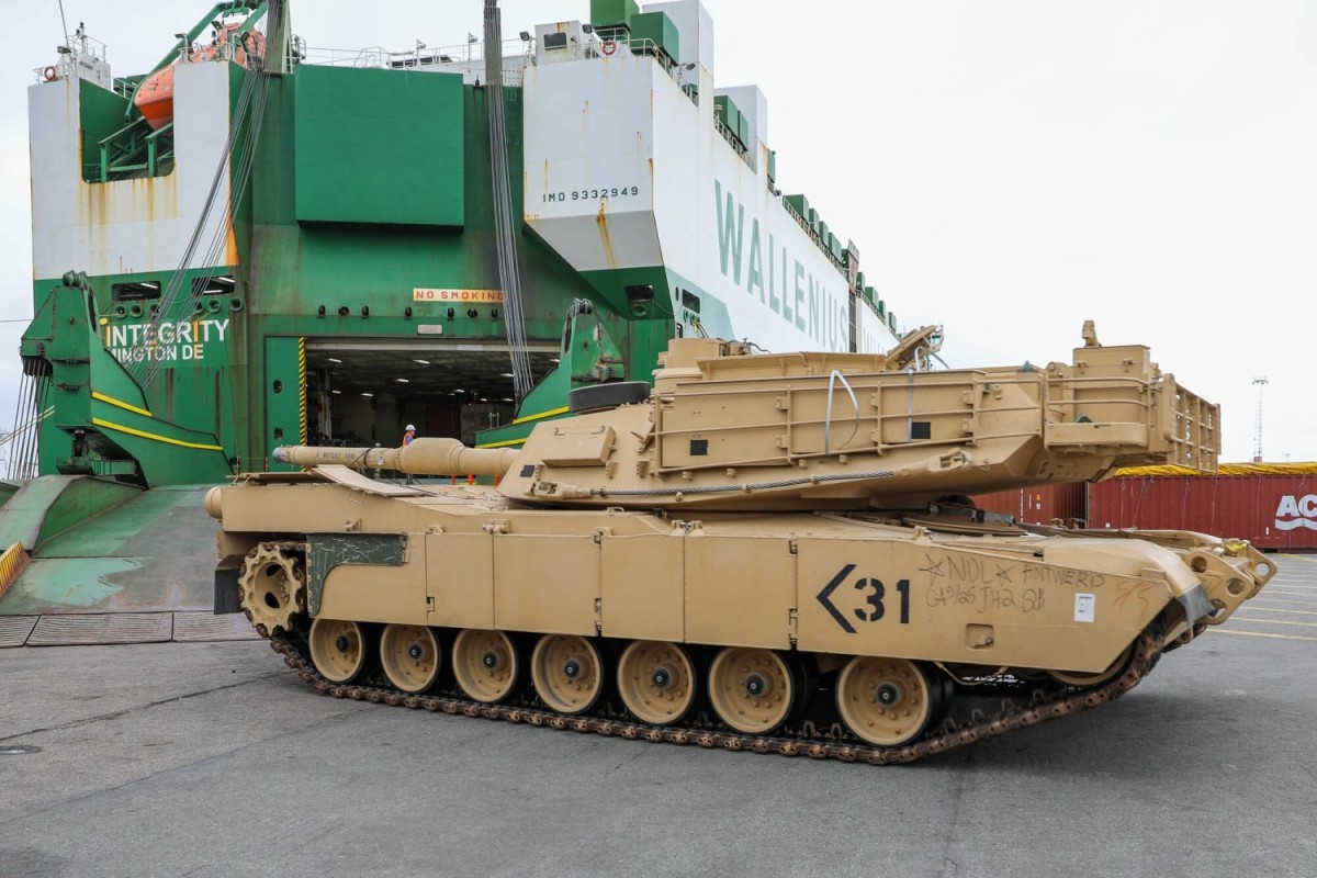 An M1A2 Abrams tank belonging to 3rd Armored Brigade Combat Team, 1st Cavalry Division, rolls down the ramp of ARC Integrity at the port Antwerp-Bruges, Belgium, July 21, 2022. 4,200 U.S. Soldiers from 3rd ABCT and 2,700 pieces of equipment will arrive for the rotational deployment and will be transported to their destination by rail, commercial line-haul and barge. (Natalie Weaver)