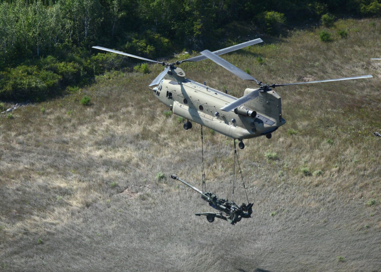 A U.S. Army CH-47F performs a sling load during a training exercise. (Fred Troilo photo)
