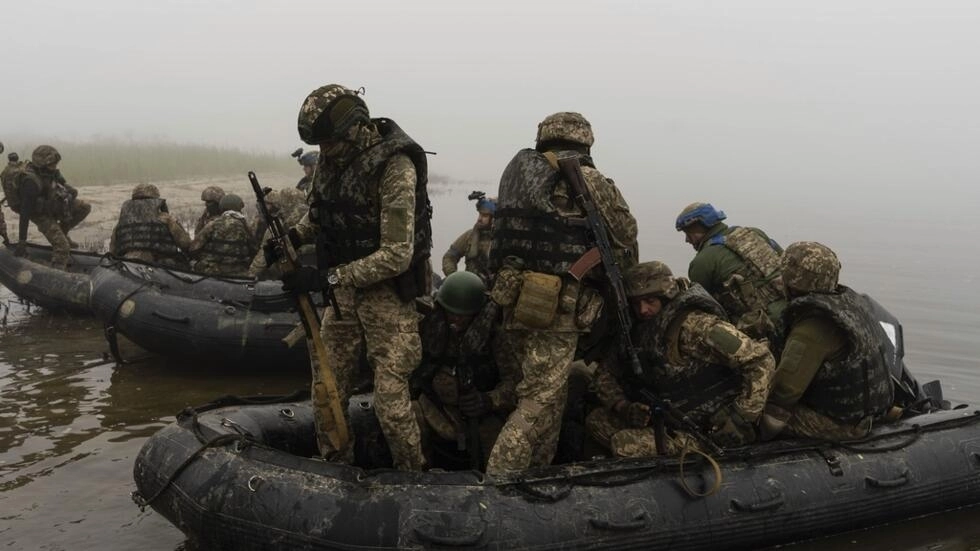 A group of Ukrainian marines sail from the bank of the Dnipro River on the front line near Kherson, Ukraine, Saturday, Oct. 14, 2023. AP - Alex Babenko