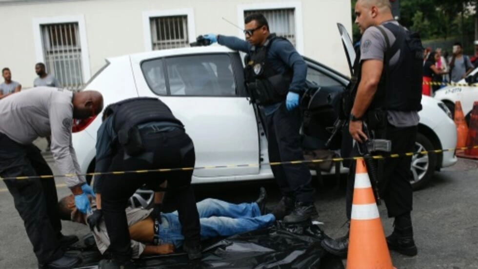 Outrage is growing in Brazil against violent crimes, such as the murder of a man found shot dead inside a car in Rio de Janeiro in October. AFP/File